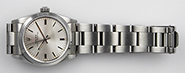 Mid Mid-Size Rolex Oyster Perpetual Silver Dial 67480